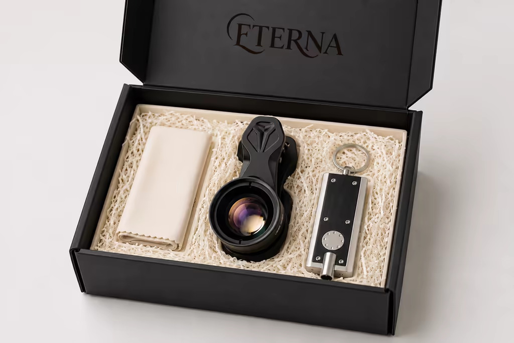The Eterna kit — an open box holding the macro lens, a pocket light and a cloth